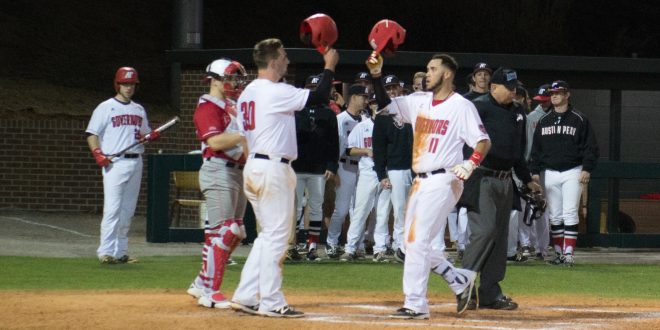 Parker Phillips meets Dre Gleason at home plate in the 2017 season. STAFF PHOTOGRAPHER | THE ALL STATE