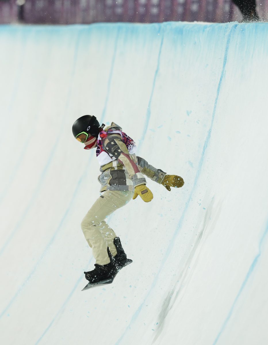 Shaun White of the United States bounces off the edge of the half pipe during the men's snowboard halfpipe final at the Rosa Khutor Extreme Park, at the 2014 Winter Olympics, Tuesday, Feb. 11, 2014, in Krasnaya Polyana, Russia. ANDY WONG | ASSOCIATED PRESS 