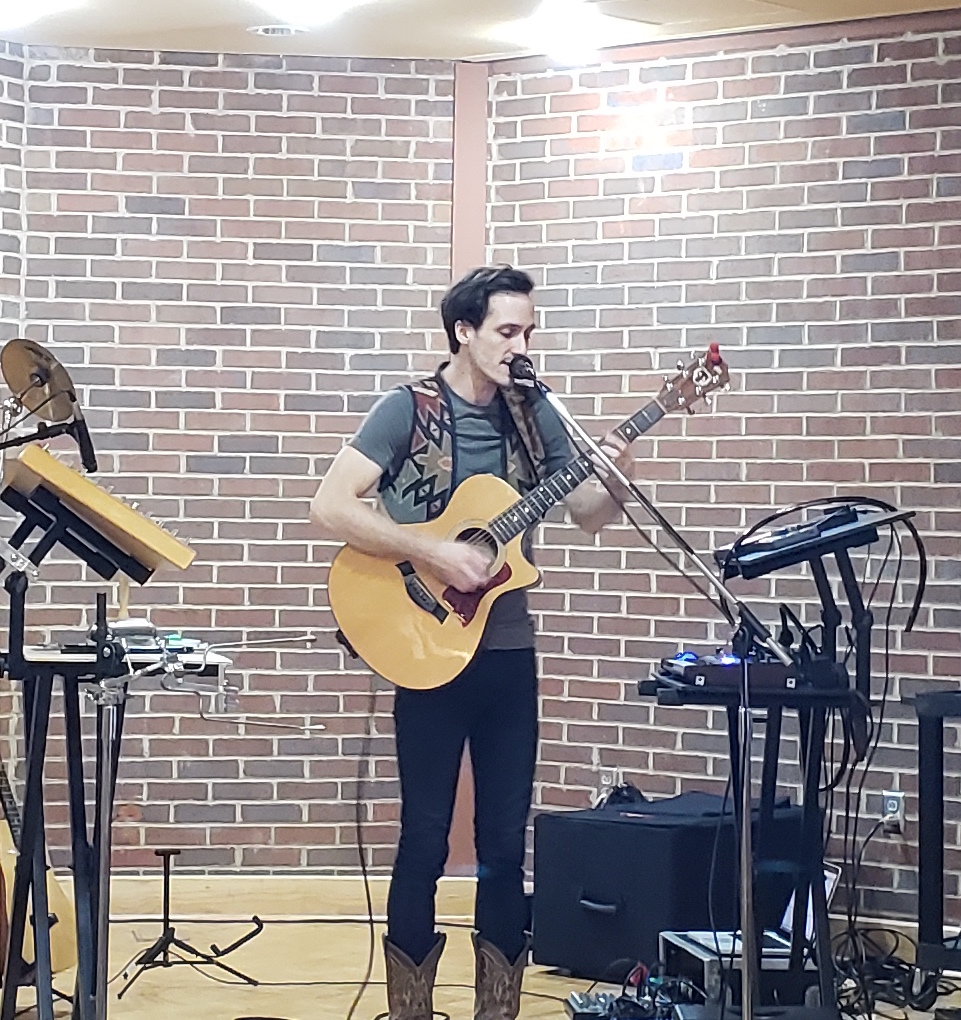 Lucas Carpenter plays at Einstein's Bagels. Photo by Jordan Potenza.