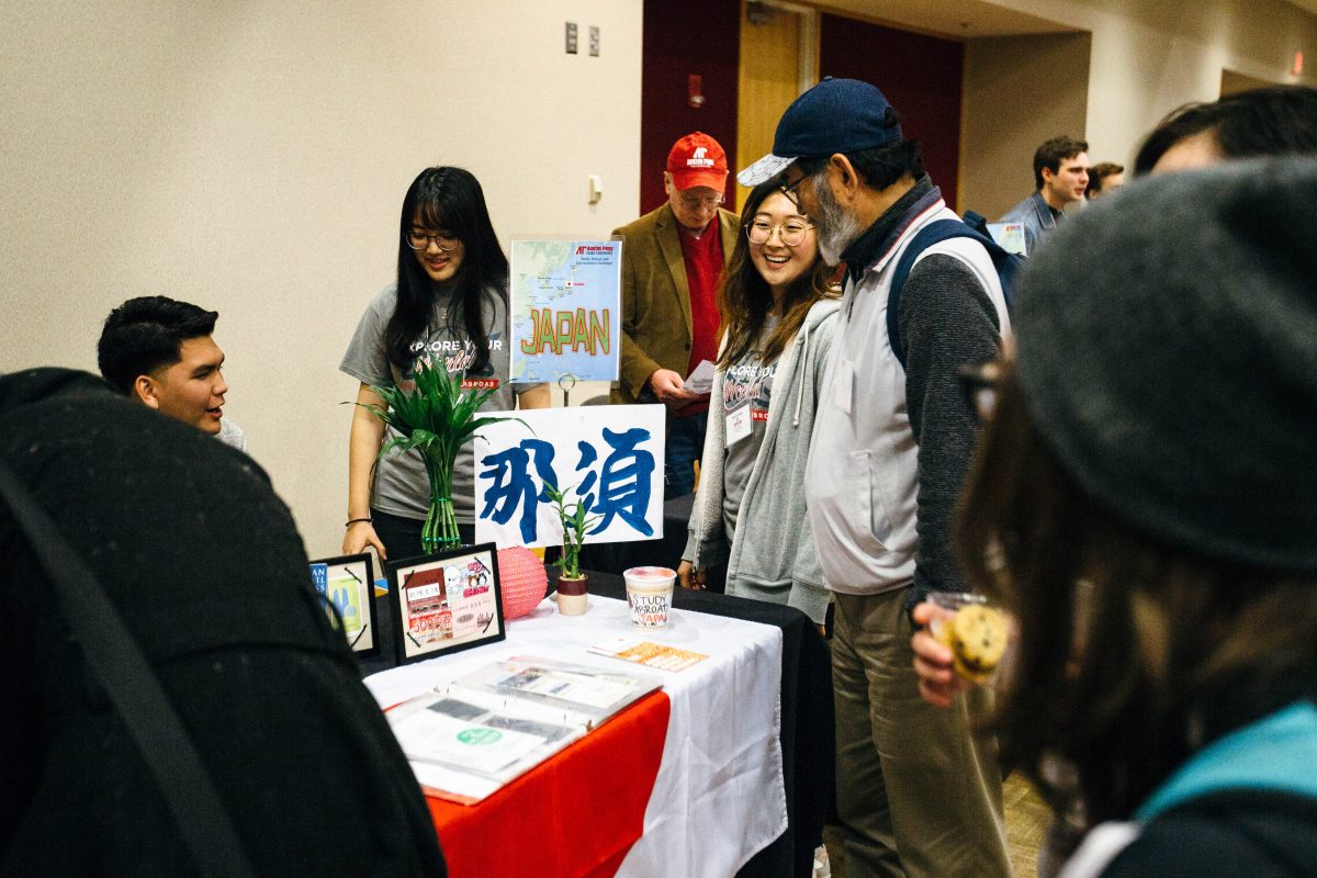 Students at a table at the Study Abroad Fair 