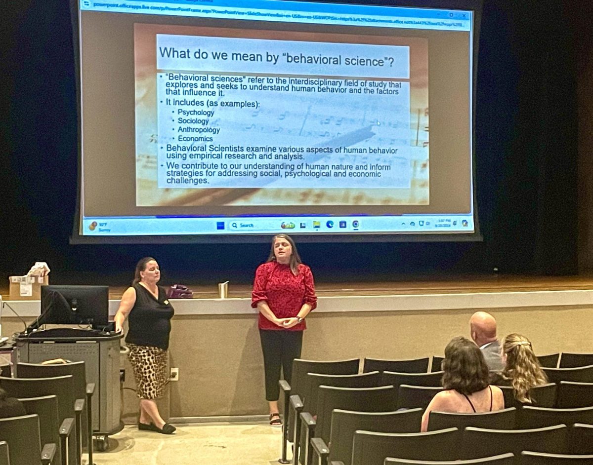 Melissa Kates (left) and Katerine Woods (right) give a presentation on Women Pop Icons and the Science of Leadership in the Clement Auditorium Sept. 20.