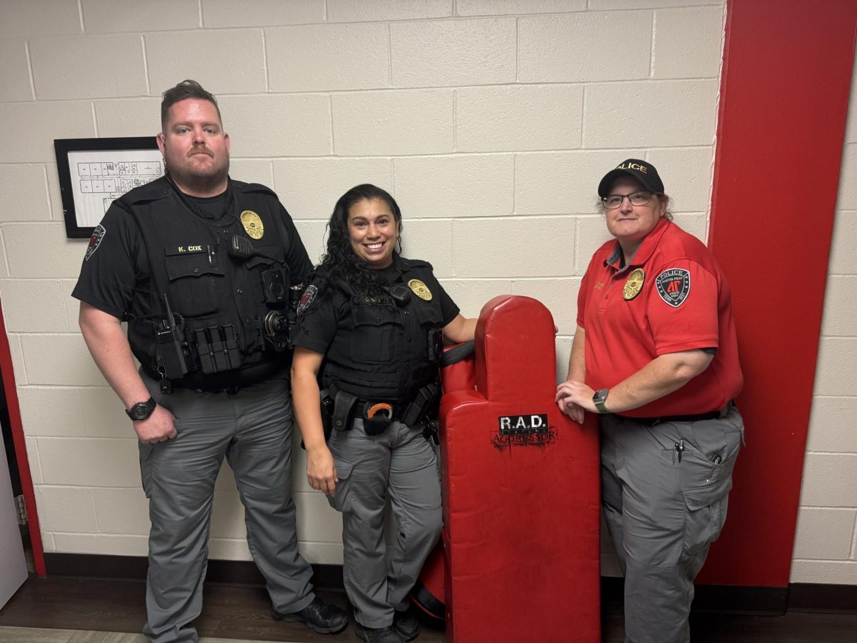 Corporal Cox, Sergeant Silva. and Sergeant Ramsey taught the self-defense class at the Domestic Violence Awareness event in the Claxton Building on Oct. 10.