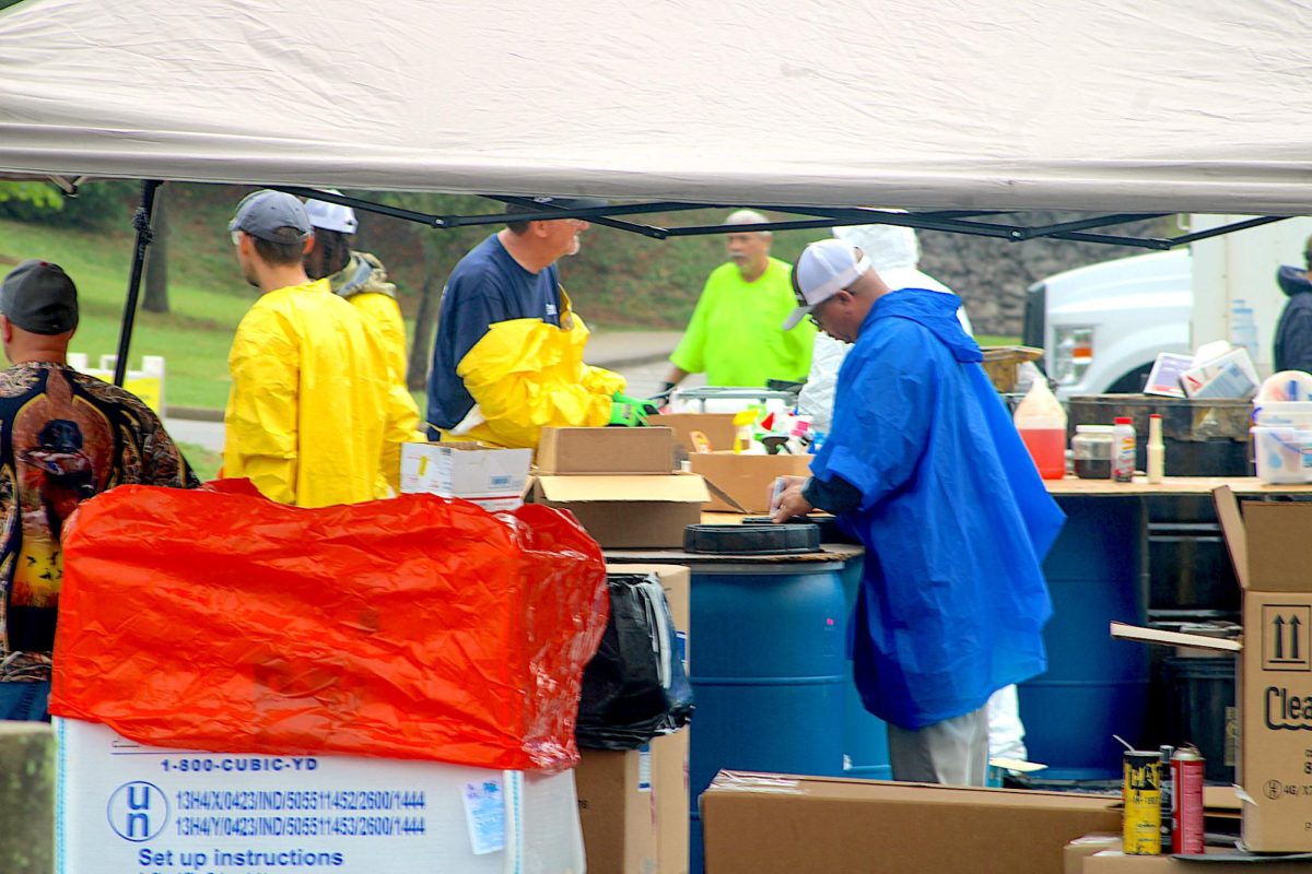 Participants sort waste at Montgomery County’s Hazardous Waste Drop Off located at Veterans Plaza on Sept. 28.