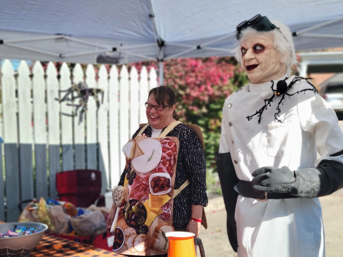 Lady Kirsten Licari joyfully interacting with with the trick-or-treaters at her booth.
