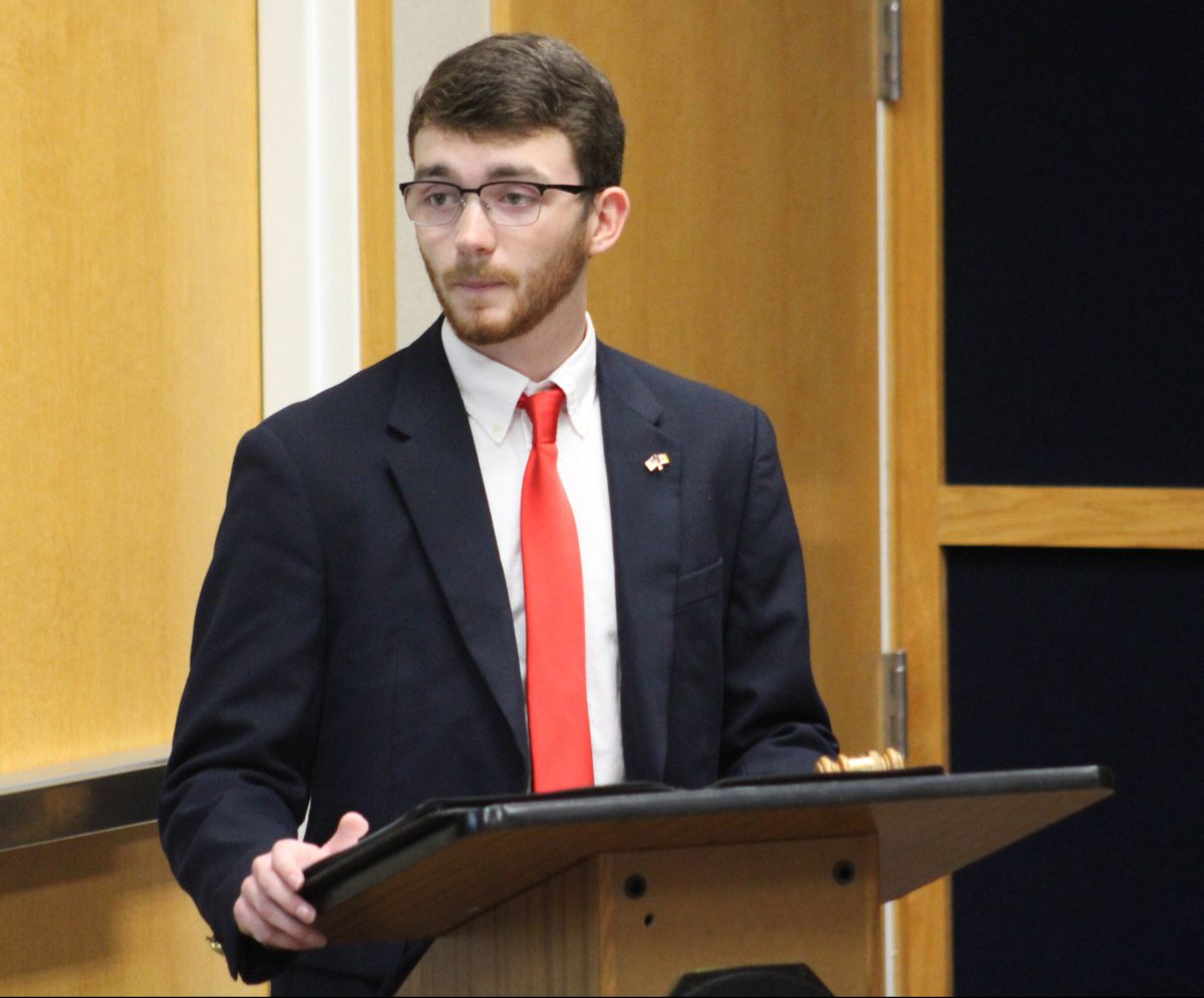 SGA VP Trevor Delane takes the podium during a weekly meeting. Photo by De'Asyia Reeder