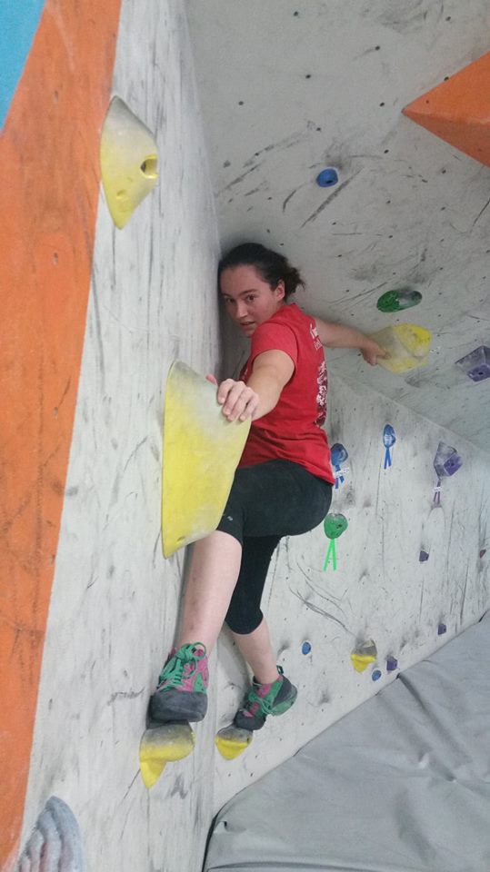 Claire Ciafre reaches out looking to find the answer to the bouldering problem in front of her. NOAH HOUCK | THE ALL STATE