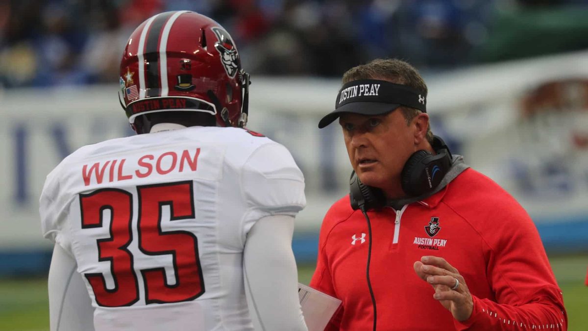 Coach Hudspeth speaking to Wilson at TSU VS APSU game. 
Photo by: APSU Athletics | Robin Smith