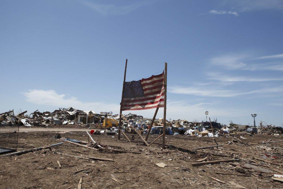 A U.S. flag is displayed at the site of Plaza Towers Elementary School May 22, 2013, in Moore, Okla. The school was destroyed when an EF5 tornado struck the area two days earlier, killing 24 people and injuring more than 200 others. (U.S. Army National Guard photo by Sgt. 1st Class Kendall James/Released)