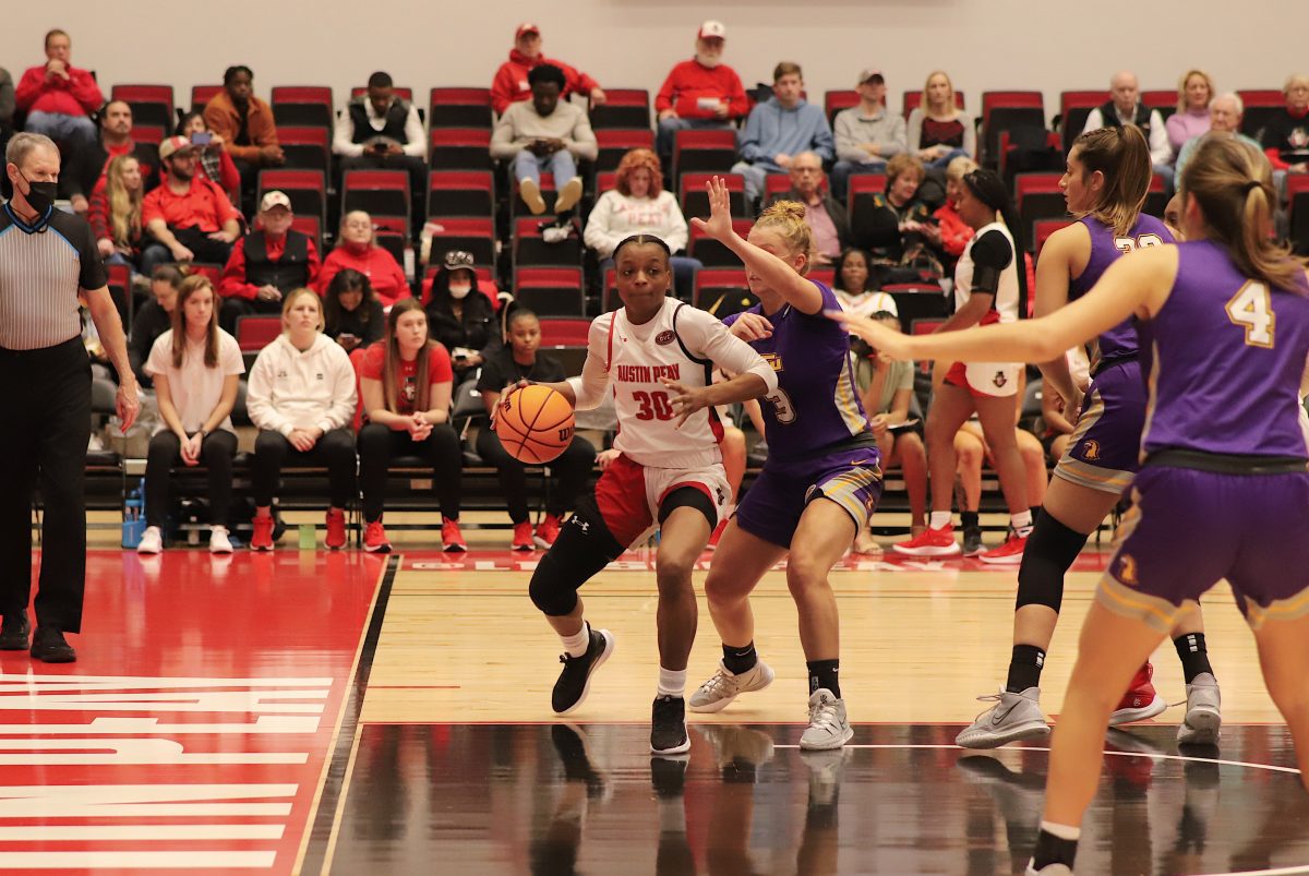 The Gov's own Liz Gibbs guards the ball against the Golden Eagle's Megan Clark at the APSU vs. TTU basketball game on Saturday, February 19 ZOE MILLS|THE ALLSTATE