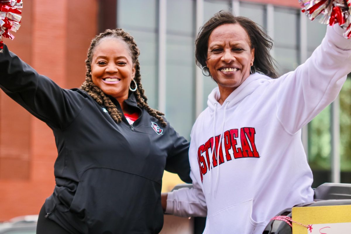 Austin Peay State University alumni cheerleaders, Shea Clardy Hill and Antionette Armstrong Watts, joined the celebration at the 79th Annual Homecoming Parade yesterday morning.