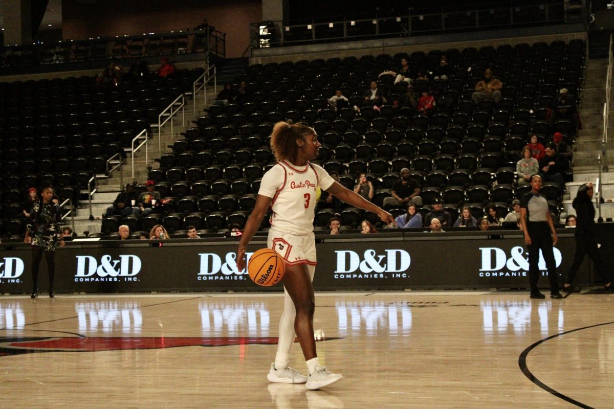 Junior guard Anala Nelson set up an offensive play as the Austin Peay State University women's basketball team defeated Queens University 66-57 at F&M Bank Arena on Feb. 20. 