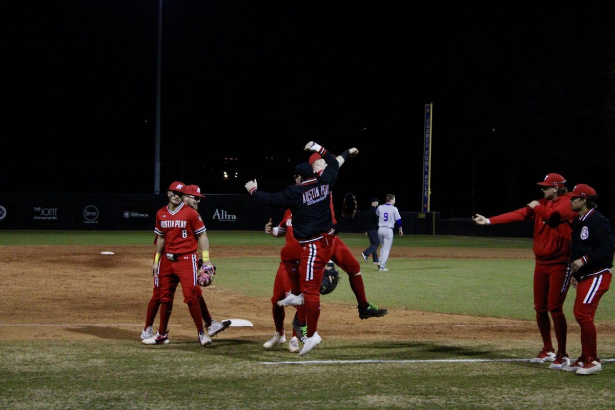 Austin Peay State University senior outfielder Cameron Nickens and senior outfielder Brody Szako celebrate after Nickens' out in Friday night's game, where the baseball team beat St. Thomas University 15-13.