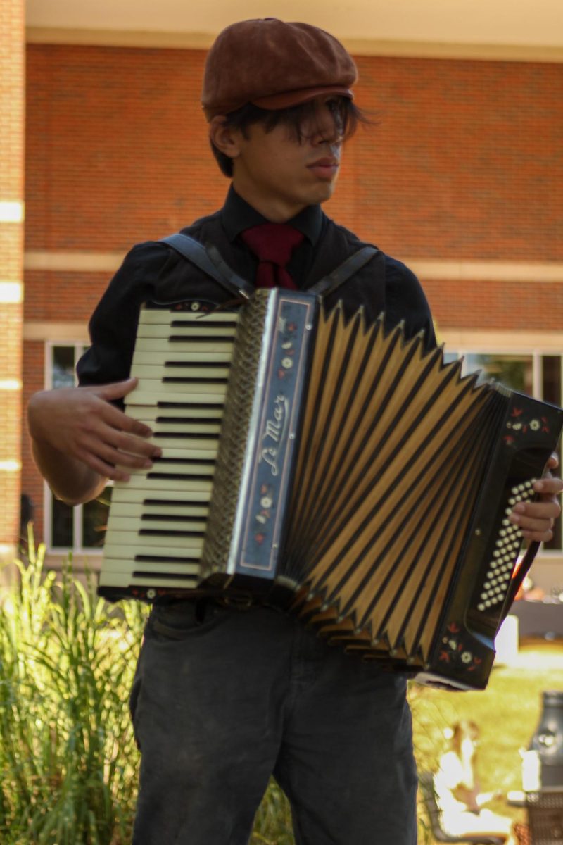 J.S. Bertoni plays the "Howls Moving Castle Theme" outside of the Woodward Library for passing students on the first day of classes. 