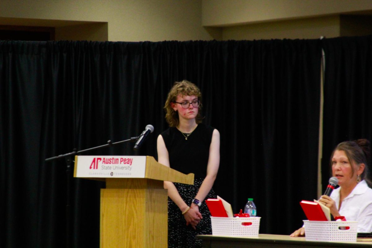 “Student Cora Anderson asks questions to panelists on stage during the PoliTalk event at the Morgan University Ballroom at Austin Peay State University in Clarksville, Tenn., on Sept. 9, 2025.
