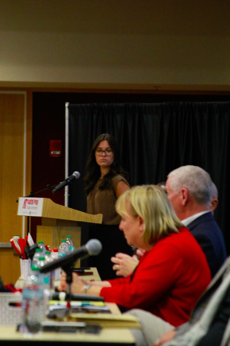 Alexandria Tetterton, chief justice of the Student Government Association, presents questions to panelists during the PoliTalk event at the Morgan University Ballroom at Austin Peay State University in Clarksville, Tenn., on Sept. 9, 2025.