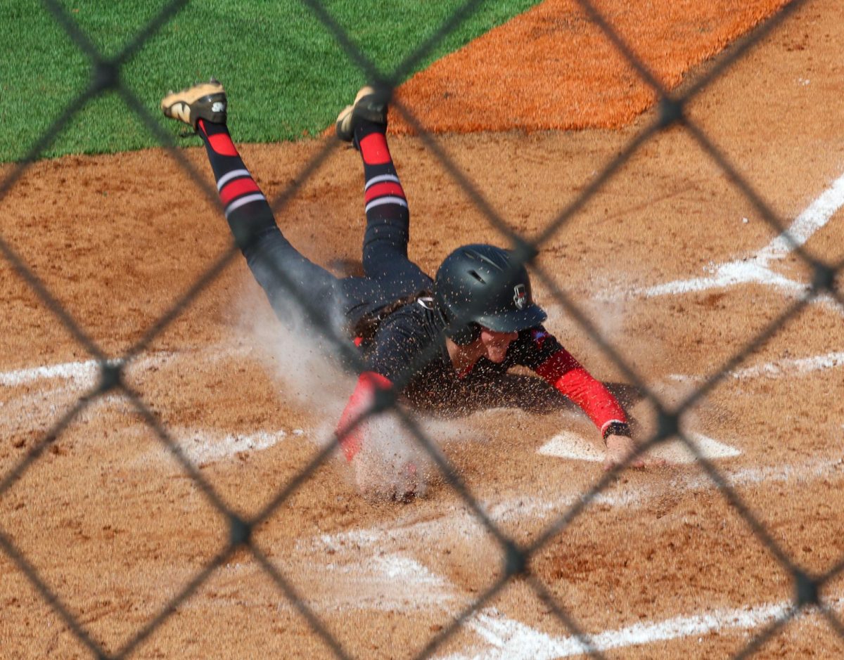 Junior outfielder Brie Howard dives toward home plate during Austin Peay’s 9-1 win over Central Michigan on Feb. 28, 2026, at Cathi Maynard Park.