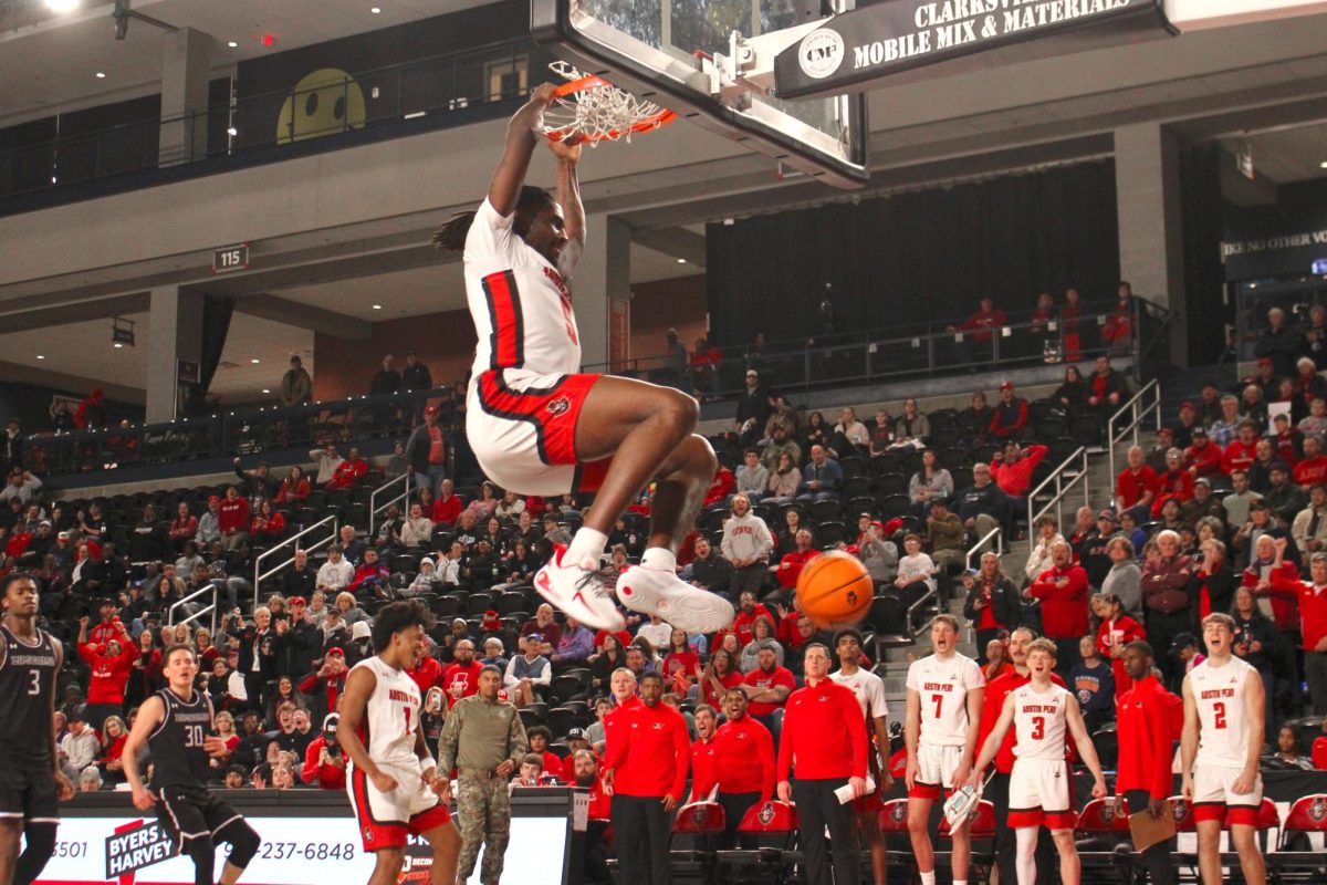 Rashaud Marshall lands a slam dunk during Austin Peay’s 87–76 win against Lipscomb University on Wednesday, Feb. 4, 2026.