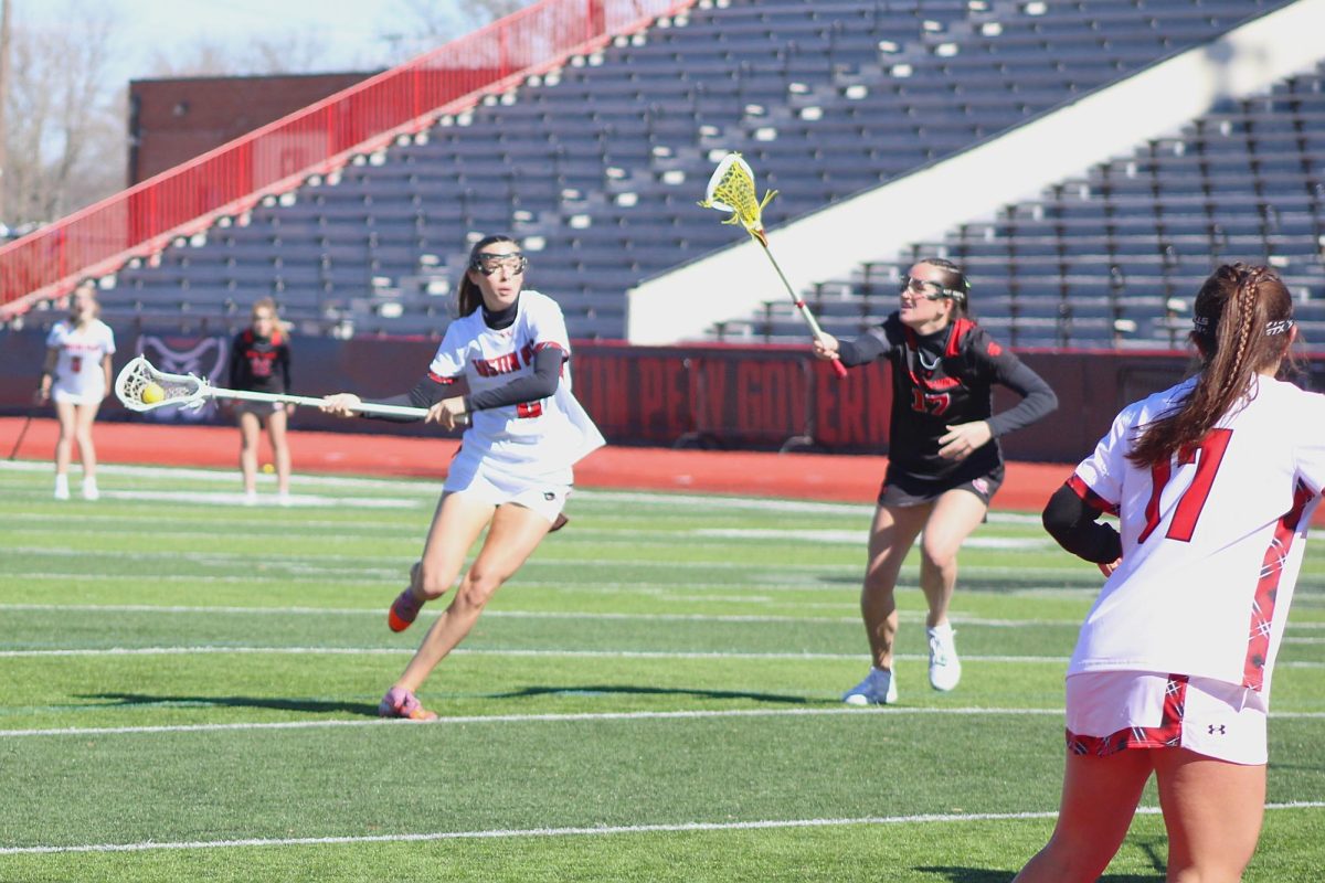 Tori Ross evades a Gardner-Webb defender while passing the ball to her teammate Nora Thurman during Austin Peay's 15-14 win against Gardner-Webb on Saturday, Feb. 7, 2026.