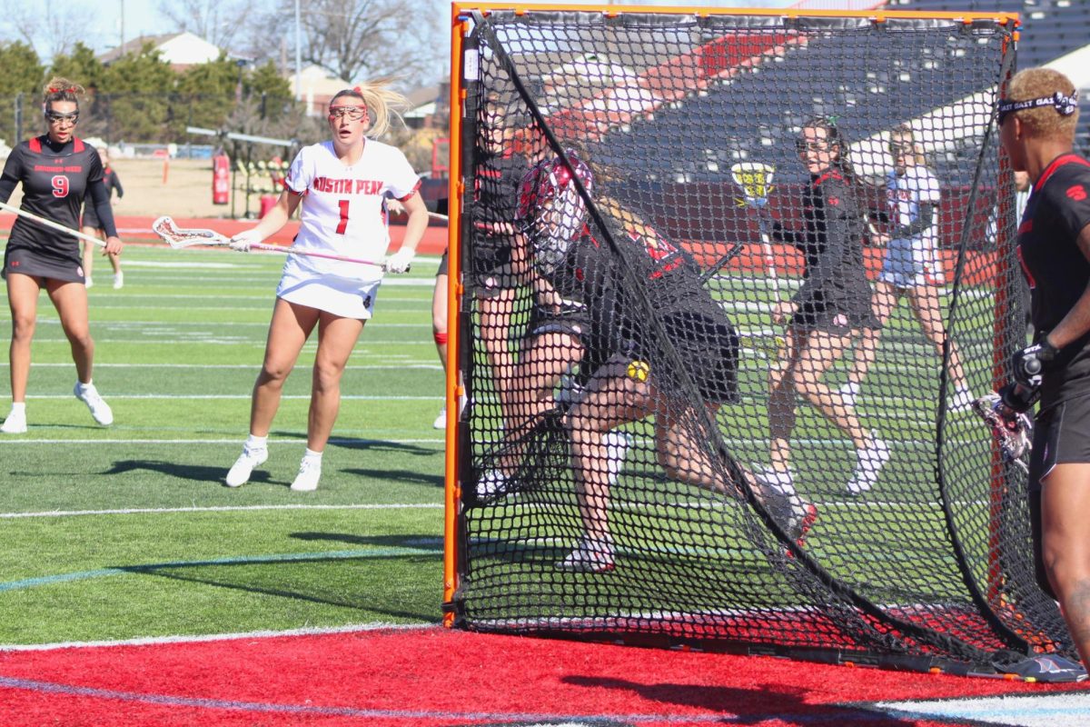 Mak Patten scores a goal while surrounded by Gardner-Webb defenders during Austin Peay's 15-14 win against Gardner-Webb on Saturday, Feb. 7, 2026.