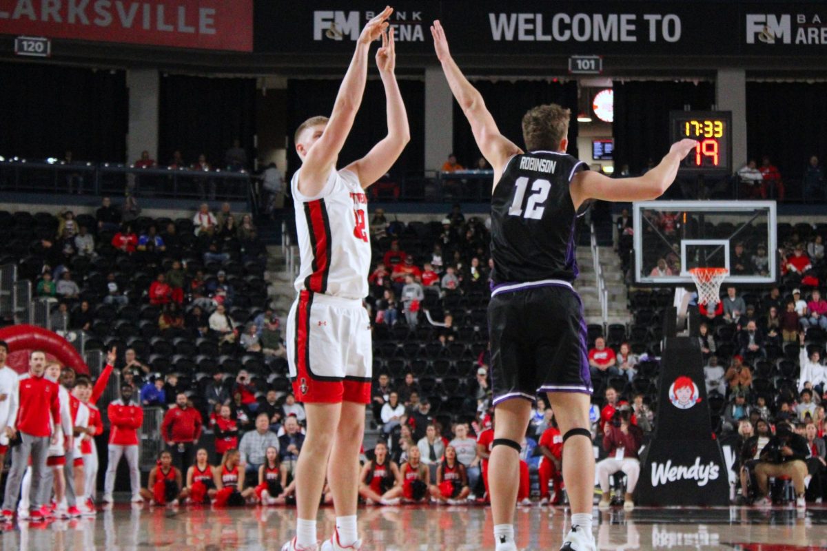 Collin Parker shoots a 3-pointer over the head of a Central Arkansas defender during a 93-88 loss to Central Arkansas on Feb. 25, 2026.