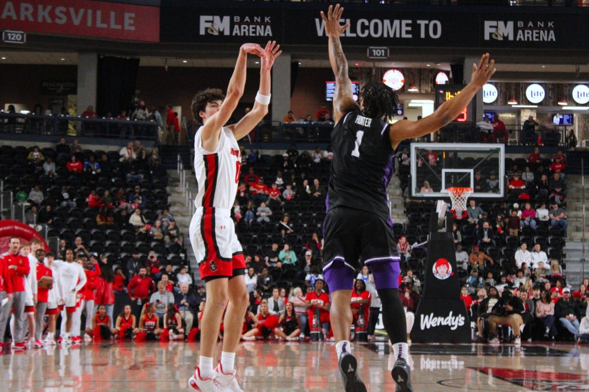 Tate McCubbin sends the ball over the head of a Central Arkansas defender for a 3-pointer during a 93-88 loss to Central Arkansas on Feb. 25, 2026.
