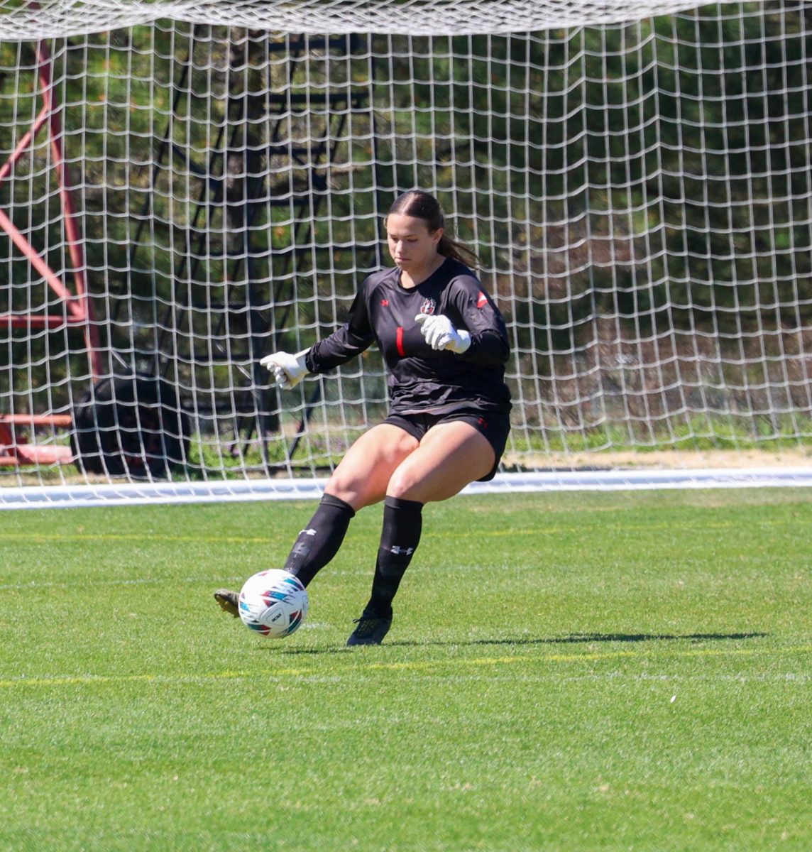 Austin Peay State University junior goalkeeper Lauryn Berry kicks the ball back into play after her save during a 3-2 loss to Southern Illinois University Saturday afternoon, March 28.