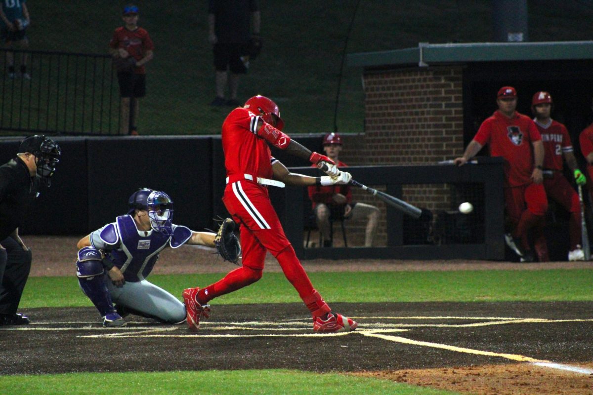 Austin Peay State University senior Zion Taylor hits to get on base during an 11-8 loss to Lipscomb University on Friday, March 20, at Raymond C. Hand Park.