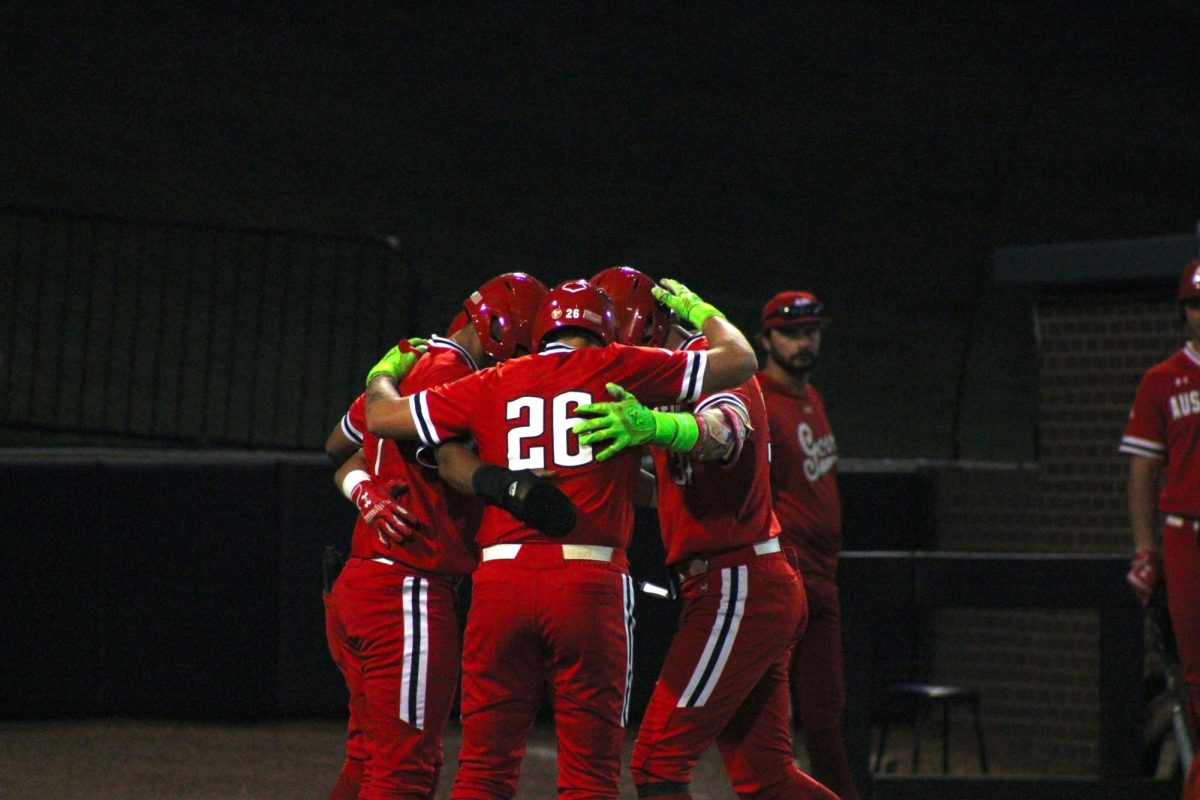 Austin Peay State University senior Zion Taylor, junior Ty Wisdom, redshirt sophomore Cole Johnson, and redshirt junior Ray Velazquez celebrate at home plate.