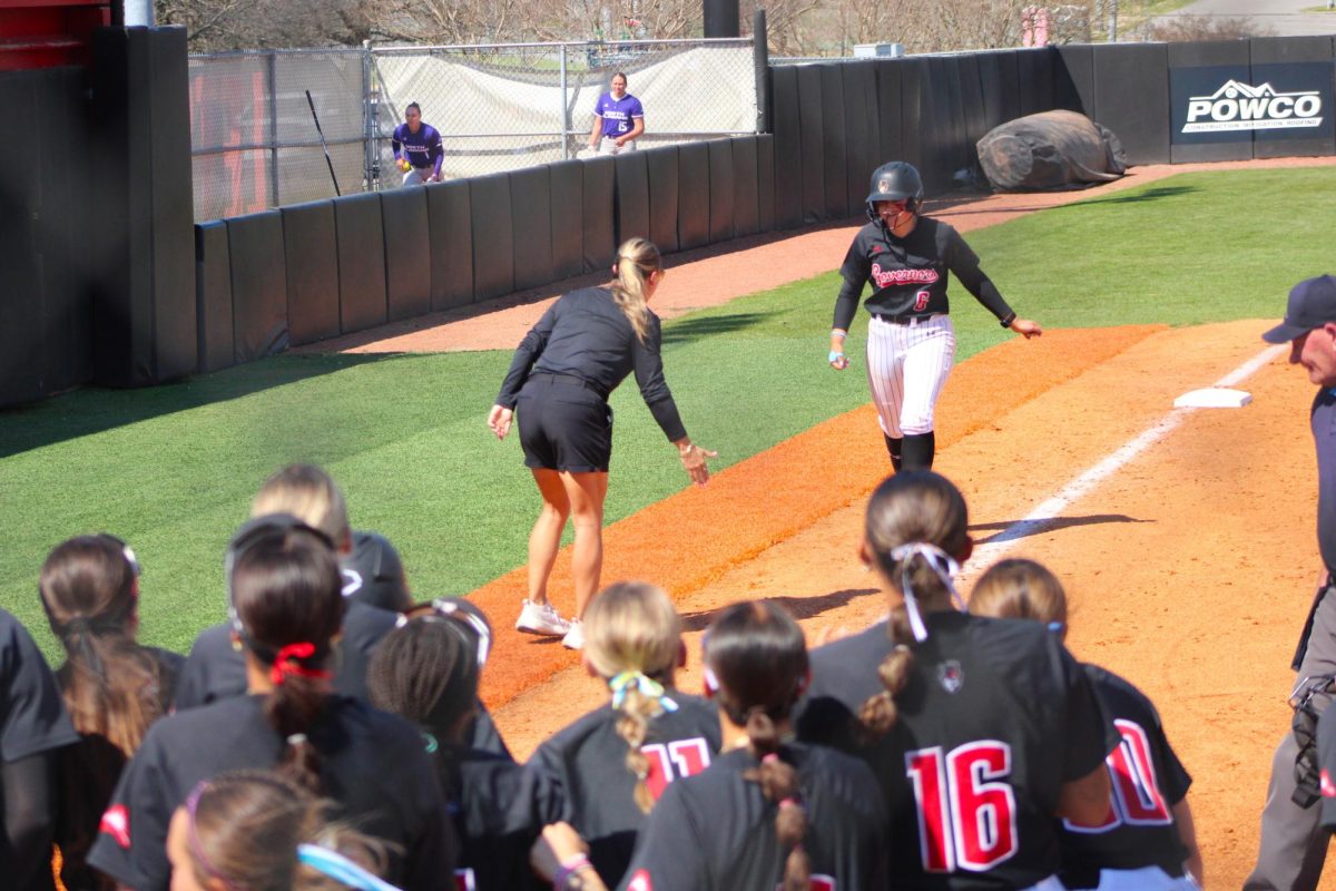 The Austin Peay State University softball team celebrates senior Ashlyn Dulaney’s home run during a 5-4 loss to the University of North Alabama on Sunday, March 22, at Cathi Maynard Park.