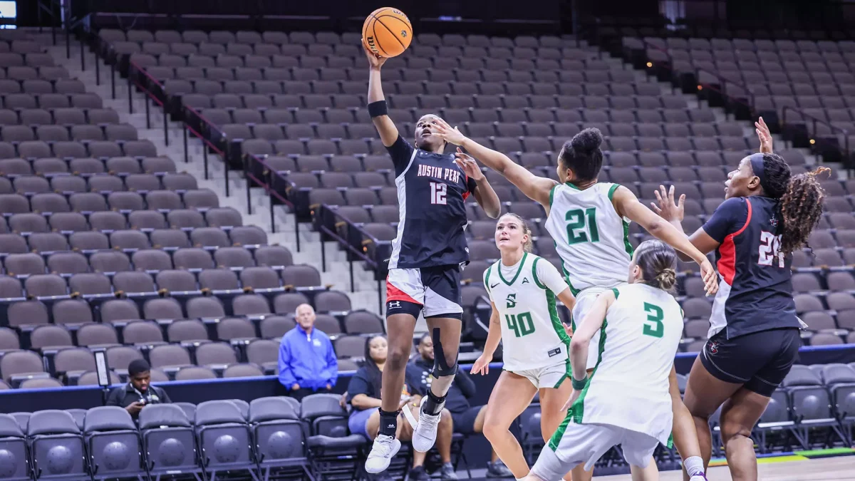 Austin Peay State University guard Jim'Miyah Branton rises for a shot over Stetson defenders during the ASUN Tournament on March 7, 2026, at VyStar Veterans Memorial Arena in Jacksonville, Florida. The Governors defeated the Hatters 68-52 to advance to the ASUN Championship.