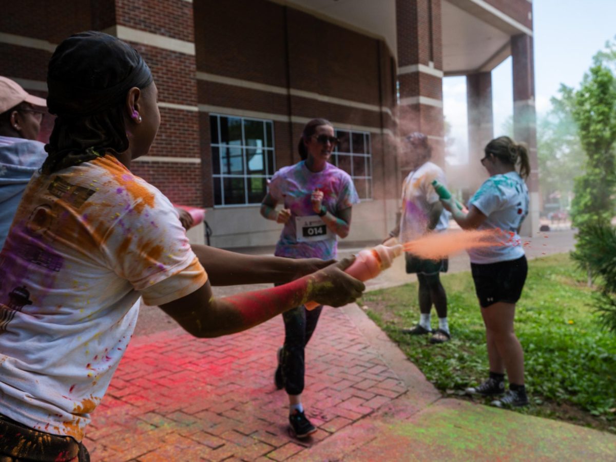APSU student participates in the annual Color Run Sunday, April 19, on Austin Peay's campus hosted by APSU Student Life and Engagement.