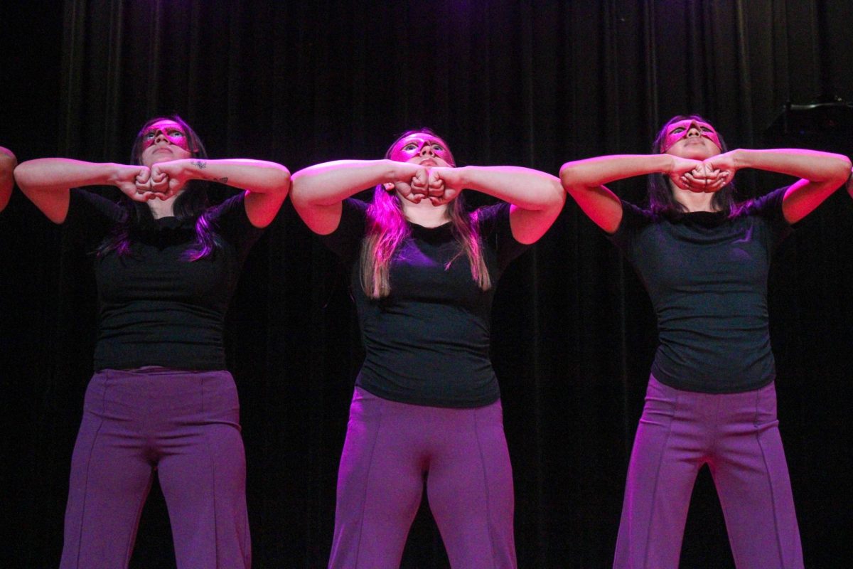New members Sofia Carrizales, Jenifer Garduno and Nora Somers of the Associate Chapter of Sigma Lambda Gamma Sorority, Inc. stand shoulder to shoulder during their reveal Friday night, April 18, 2026.