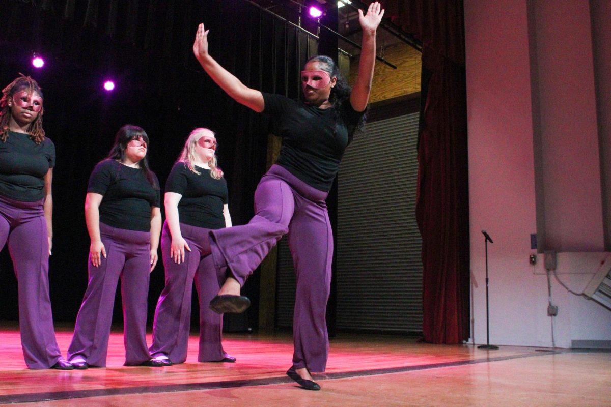 New member Yavilka Peñaloza of the Associate Chapter of Sigma Lambda Gamma Sorority, Inc. performs during her reveal Friday night, April 18, 2026.