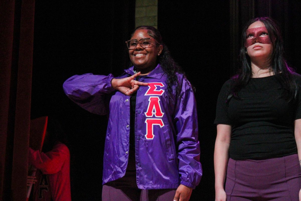 New member Yavilka Peñaloza of the Associate Chapter of Sigma Lambda Gamma Sorority, Inc. smiles while holding her letters after her reveal Friday night, April 18, 2026.