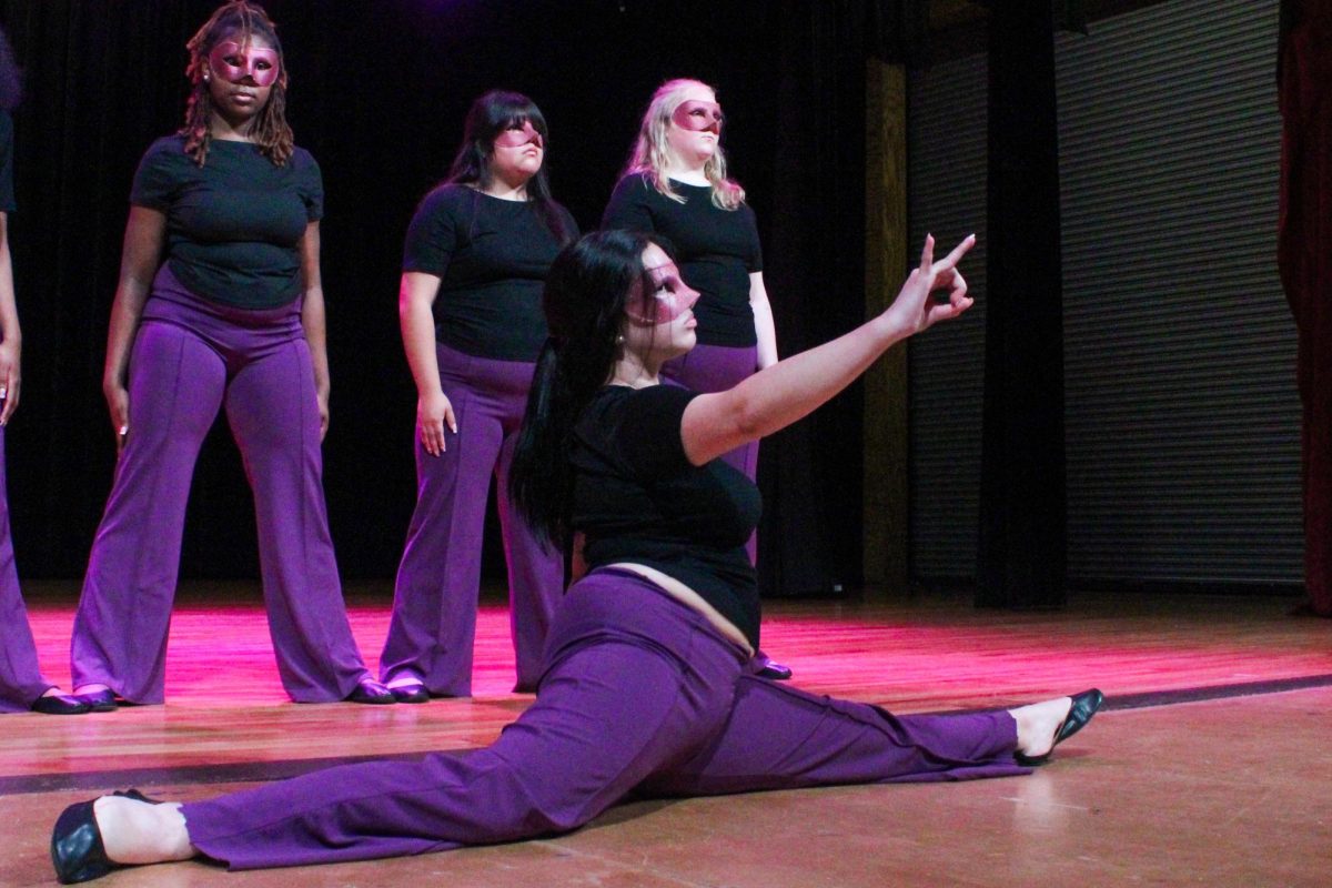New member Sofia Carrizales of the Associate Chapter of Sigma Lambda Gamma Sorority, Inc. performs a split and holds the pose during her reveal Friday night, April 18, 2026.