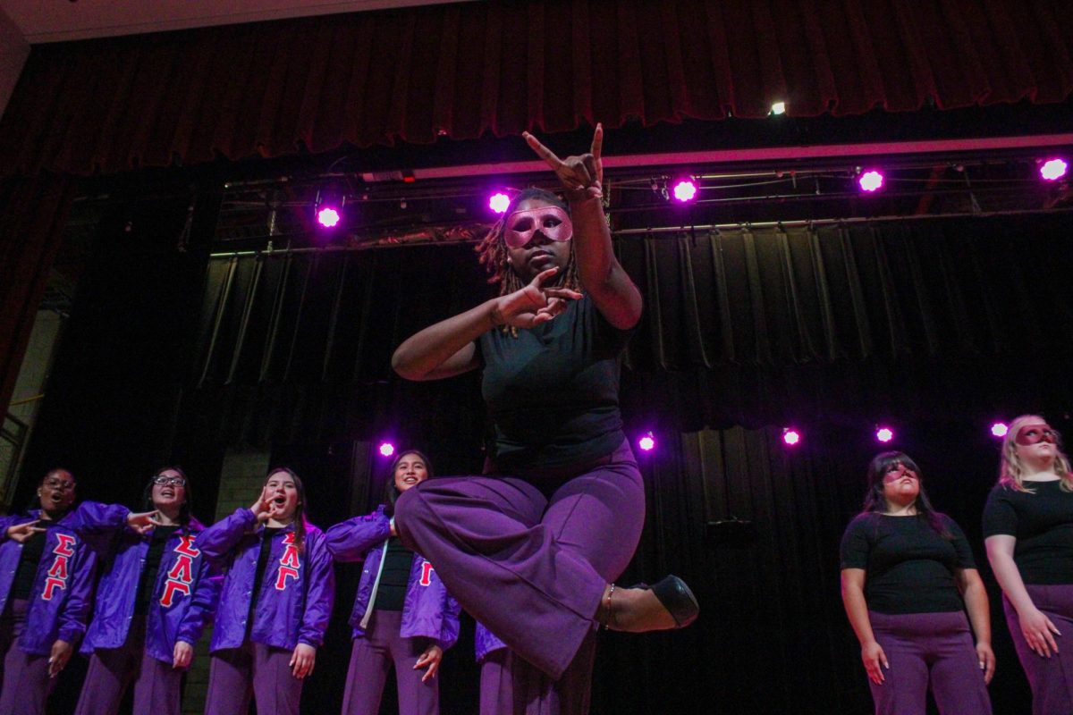 New member Shaturah Tuma of the Associate Chapter of Sigma Lambda Gamma Sorority, Inc. poses front and center during her reveal Friday night, April 18, 2026.