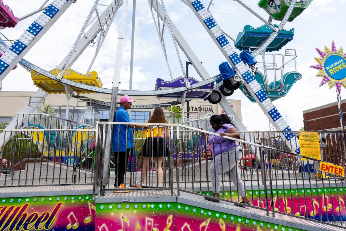 Austin Peay State University students board the Ferris wheel during the Springtacular carnival, Saturday, April 11, hosted by the Office of Student Life and Engagement and the Student Government Association in the Fortera Stadium parking lot.