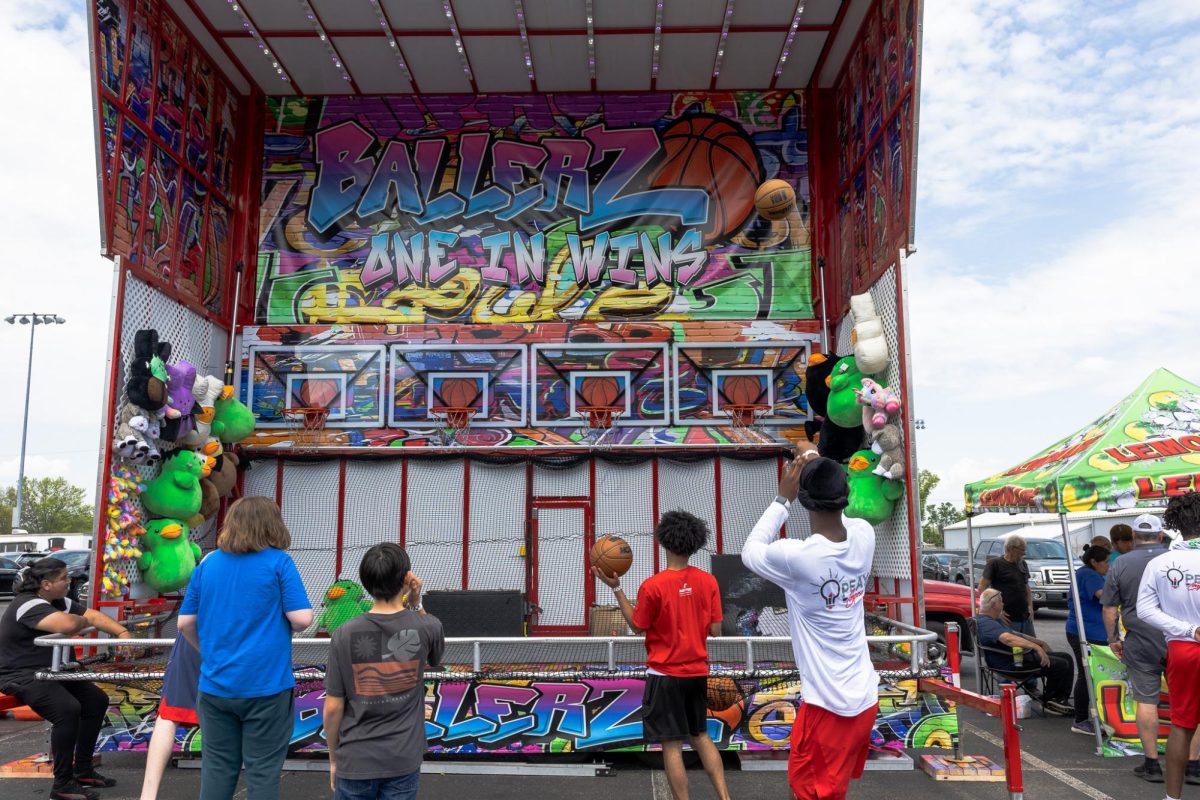 Austin Peay State University students play a basketball game during the Springtacular carnival, Saturday, April 11, at the Fortera Stadium parking lot, hosted by the Office of Student Life and Engagement and the Student Government Association.