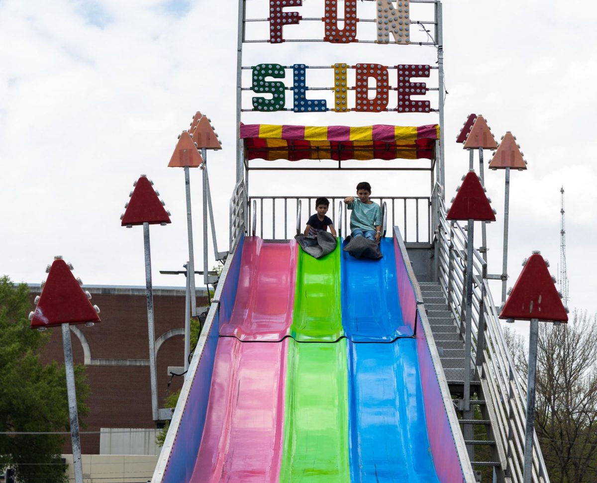 Austin Peay State University carnival attendees enjoy a slide during the Springtacular carnival, Saturday, April 11, at the Fortera Stadium parking lot, hosted by the Office of Student Life and Engagement and the Student Government Association.