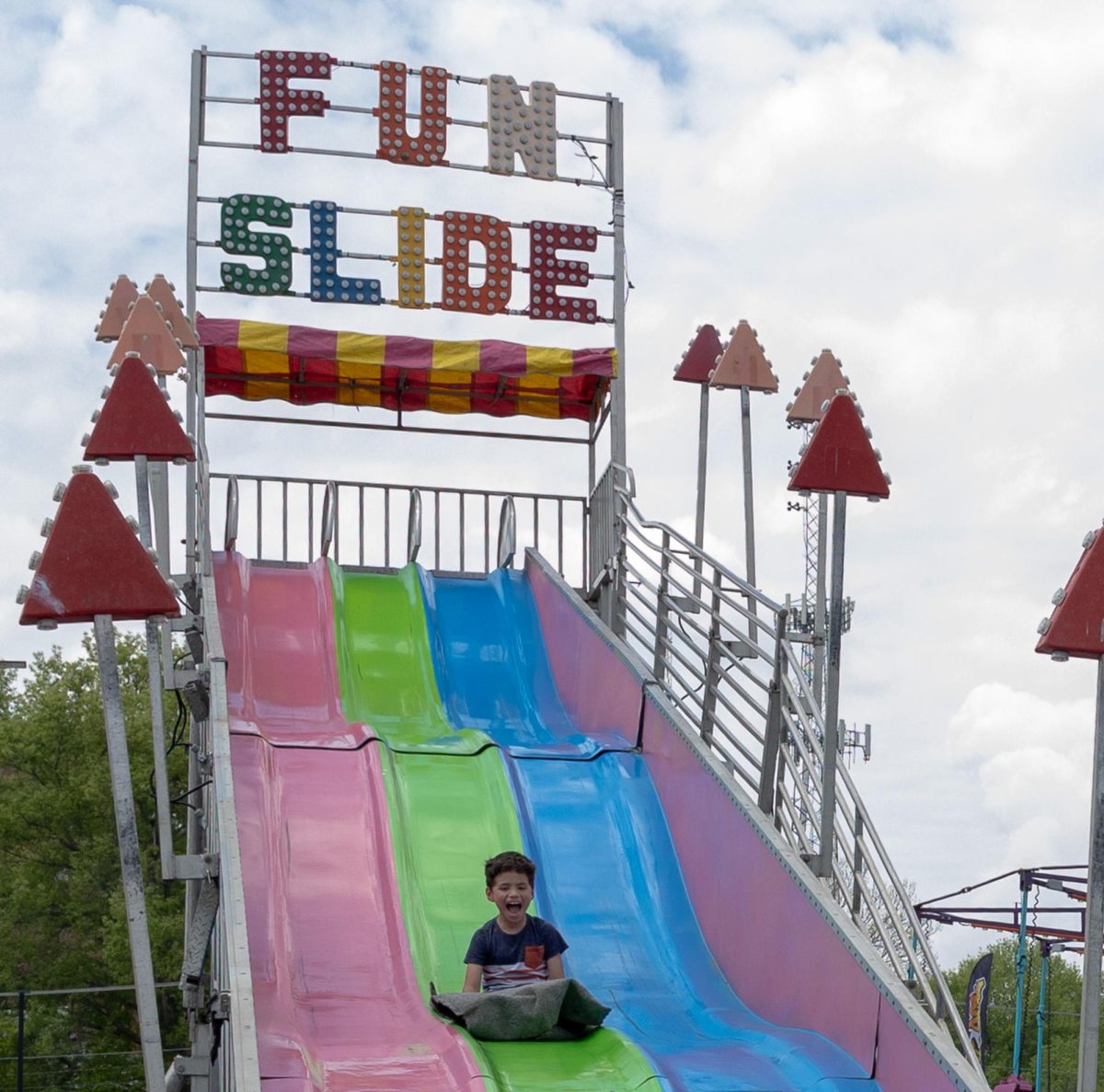 Austin Peay State University carnival attendee enjoys a slide during the Springtacular carnival, Saturday, April 11, at the Fortera Stadium parking lot, hosted by the Office of Student Life and Engagement and the Student Government Association.