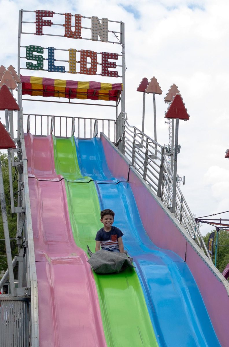 Austin Peay State University carnival attendee enjoys a slide during the Springtacular carnival, Saturday, April 11, at the Fortera Stadium parking lot, hosted by the Office of Student Life and Engagement and the Student Government Association.
