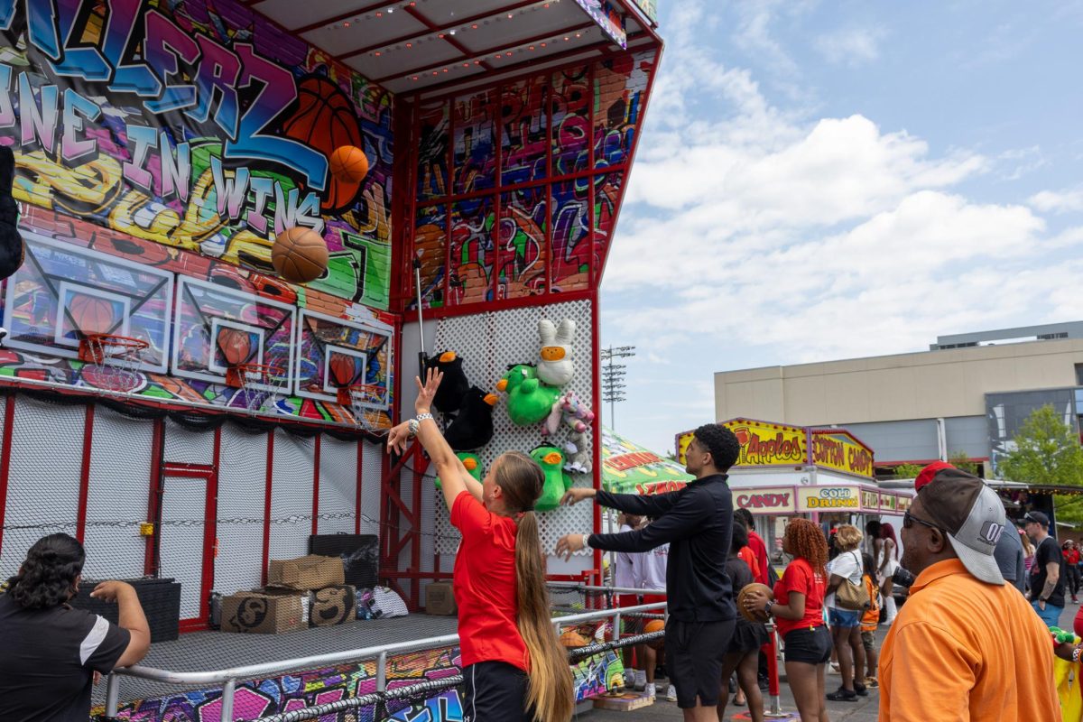 Austin Peay State University students play a basketball game during the Springtacular carnival, Saturday, April 11, at the Fortera Stadium parking lot, hosted by the Office of Student Life and Engagement and the Student Government Association.