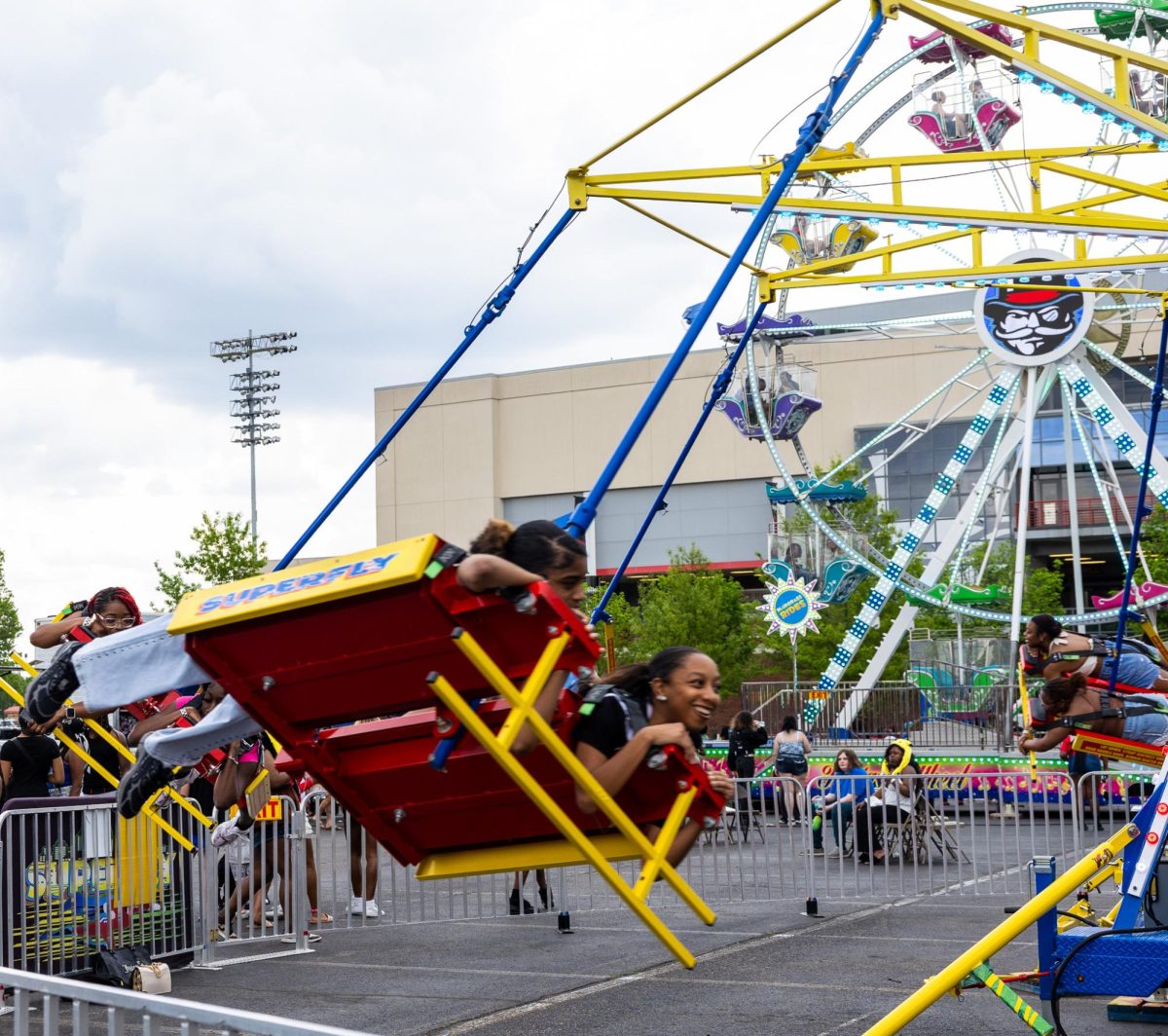 Austin Peay State University students ride the Superfly attraction during the Springtacular carnival, Saturday, April 11, in the Fortera Stadium parking lot, hosted by the Office of Student Life and Engagement and the Student Government Association.