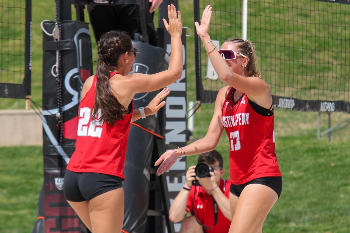Austin Peay State University freshman Cami Missig and graduate Emma Loiars high-five and celebrate after scoring during a 5-0 win against McKendree University on Friday, April 3.