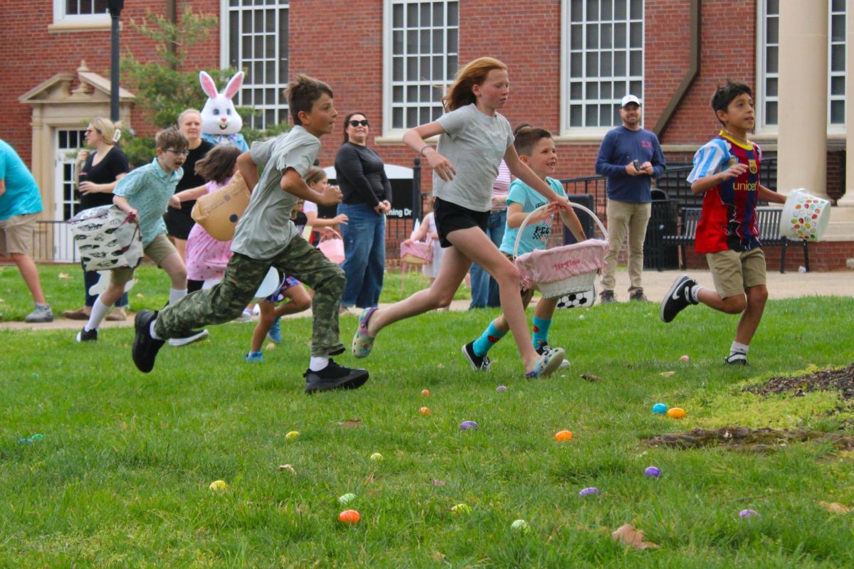 Children run to collect eggs during the annual Austin Peay Easter egg hunt on Saturday, April 4, in front of the Browning building.