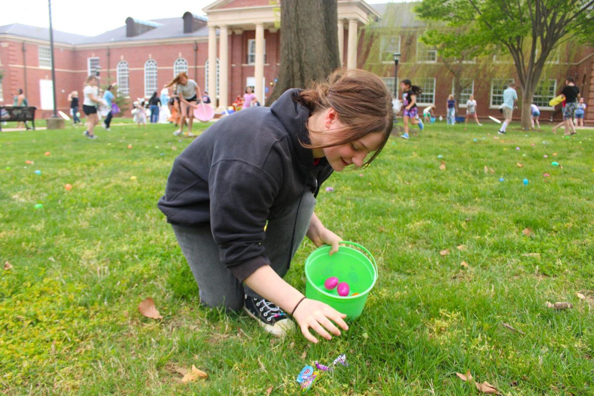 A child collects eggs during the annual Austin Peay Easter egg hunt on Saturday, April 4, in front of the Browning building.