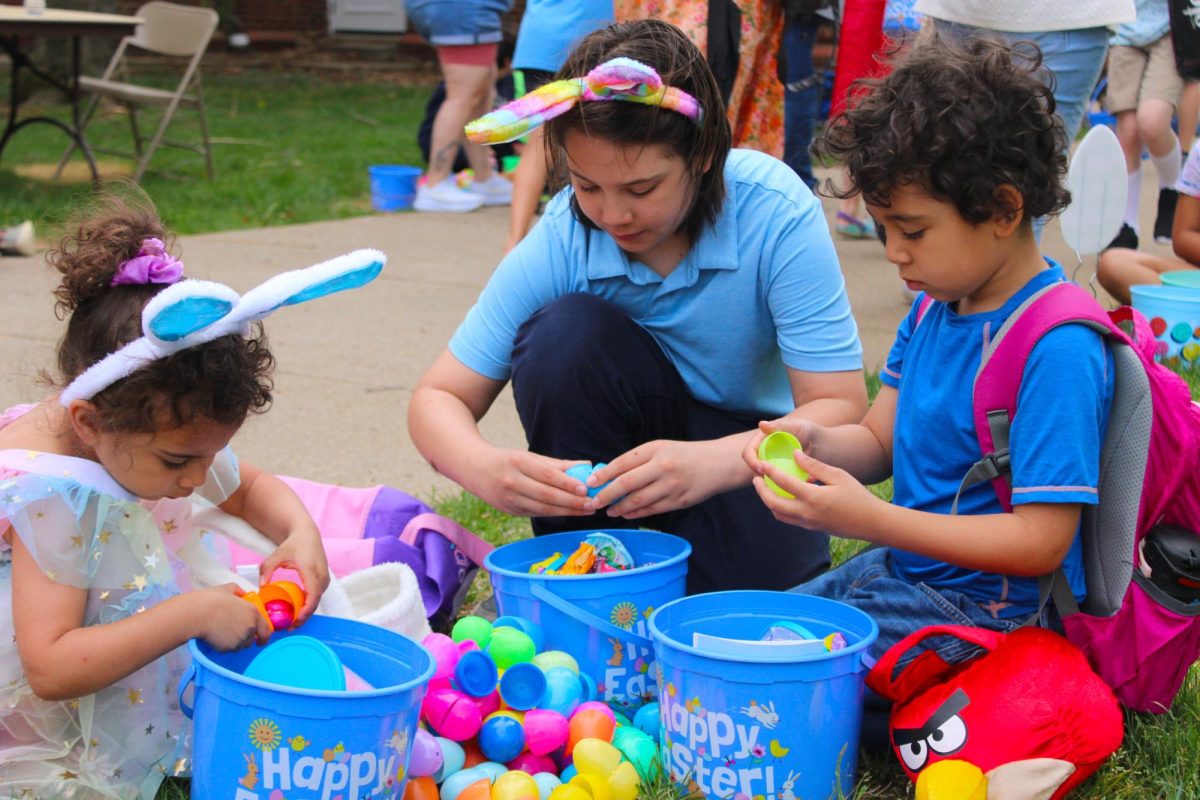 Children count their eggs together A kid goes through her gift basket won from a golden egg found during the annual Austin Peay Easter egg hunt on Saturday, April 4, in front of the Browning building.