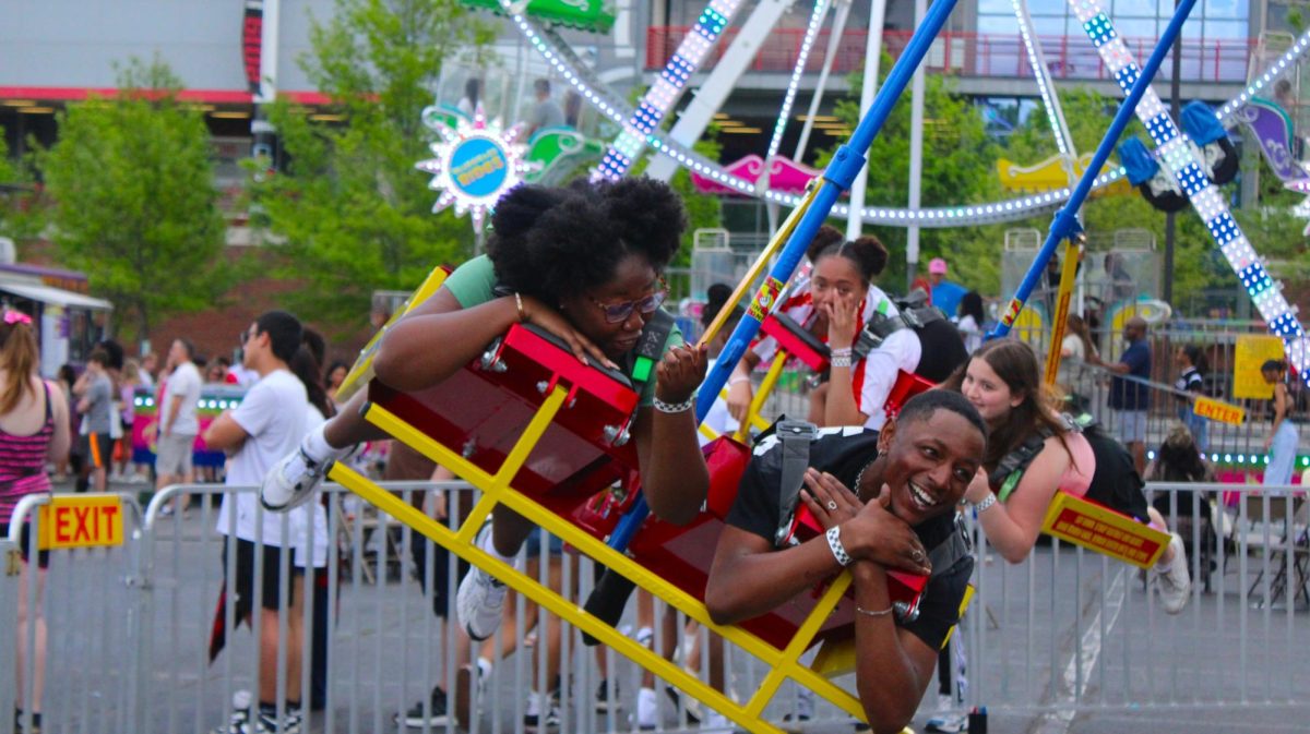 Austin Peay State University students ride an attraction during the Springtacular carnival, Saturday, April 11, in the Fortera Stadium parking lot, hosted by the Office of Student Life and Engagement and the Student Government Association.