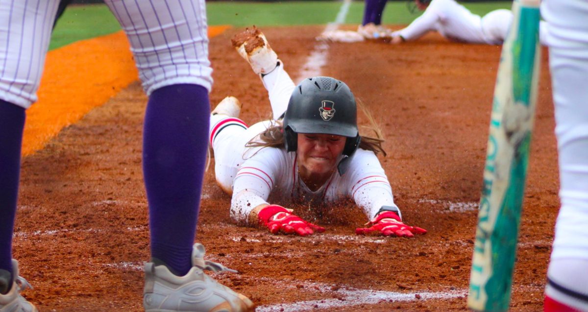 Austin Peay State University junior second baseman Kylie Hinton slides home in a 6-0 win over Lipscomb University in the first game of a doubleheader, Saturday, April 11, 2026.