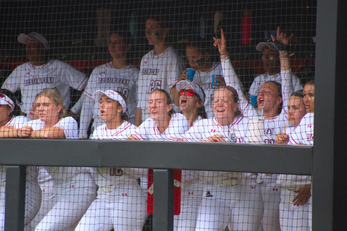 The Austin Peay State University softball team cheers from the dugout in a 6-0 win over Lipscomb University in the first game of a doubleheader, Saturday, April 11, 2026.